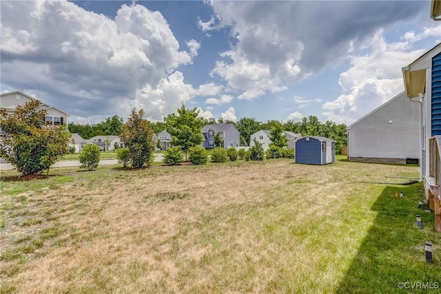 6989 Sir Galahad Rd, Henrico, VA 23231 - view of grassy yard featuring a shed and a residential view