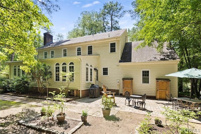 4018 Timber Ridge Rd, Chesterfield, VA 23112 - rear view of house with entry steps, a patio, and a chimney