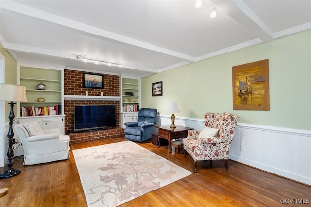 4018 Timber Ridge Rd, Chesterfield, VA 23112 - living area featuring a brick fireplace, wood finished floors, wainscoting, beamed ceiling, and rail lighting