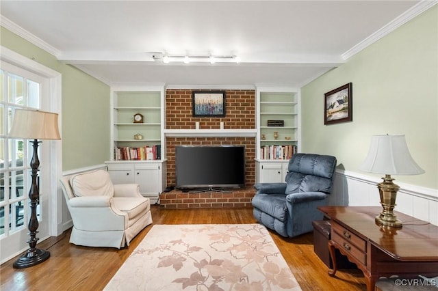 4018 Timber Ridge Rd, Chesterfield, VA 23112 - living area with wood finished floors, wainscoting, built in shelves, a fireplace, and ornamental molding