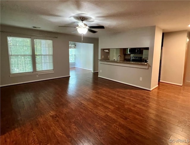 3218 Matilda Cv Unit 108, Richmond, VA 23294 - unfurnished living room featuring dark wood-style floors, a ceiling fan, and a textured ceiling