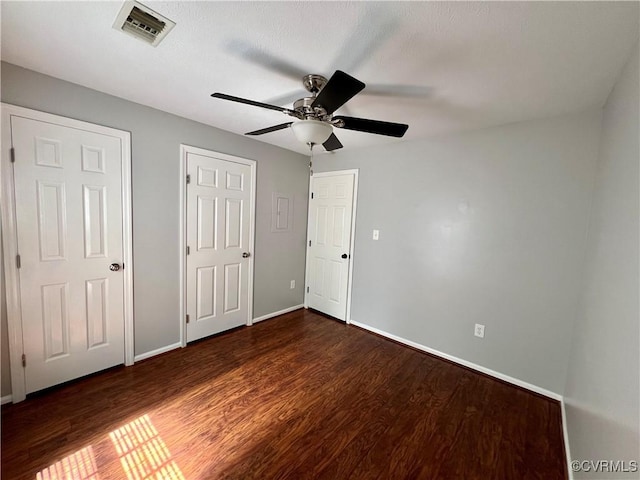 3218 Matilda Cv Unit 108, Richmond, VA 23294 - unfurnished bedroom with dark wood-type flooring and ceiling fan
