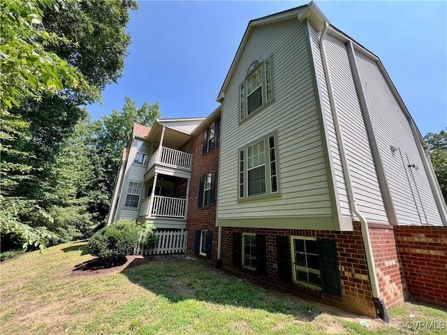 3218 Matilda Cv Unit 108, Richmond, VA 23294 - rear view of property with a lawn, a balcony, and brick siding