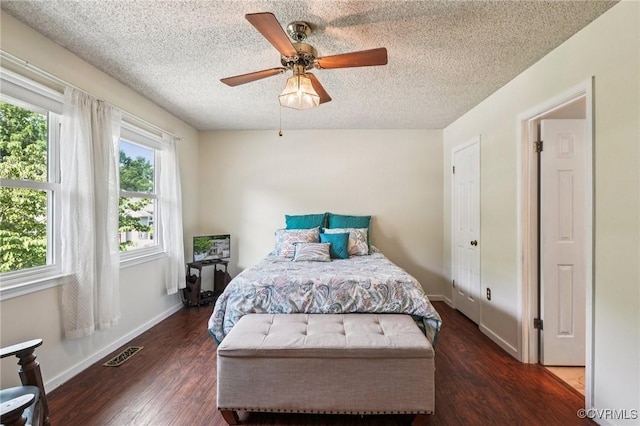 12302 Sir James Ct, Henrico, VA 23233 - bedroom featuring a textured ceiling, dark wood-style flooring, and ceiling fan