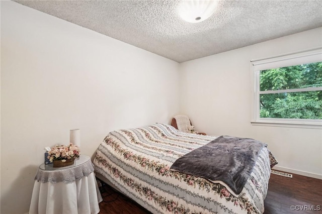 12302 Sir James Ct, Henrico, VA 23233 - bedroom featuring wood finished floors and a textured ceiling