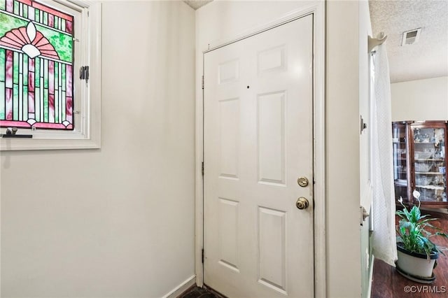 12302 Sir James Ct, Henrico, VA 23233 - doorway to outside with a textured ceiling and baseboards