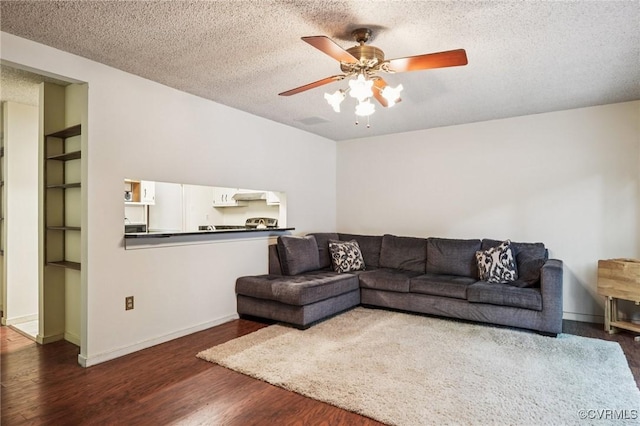 12302 Sir James Ct, Henrico, VA 23233 - living area featuring ceiling fan, wood finished floors, a textured ceiling, and built in features