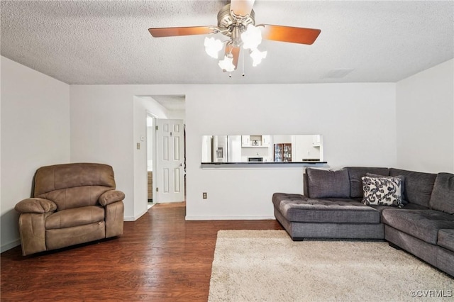 12302 Sir James Ct, Henrico, VA 23233 - living room featuring dark wood-type flooring, ceiling fan, and a textured ceiling