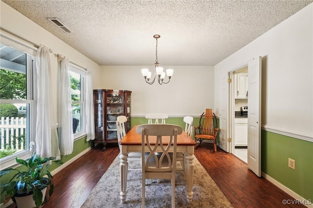 12302 Sir James Ct, Henrico, VA 23233 - dining space featuring a chandelier, a textured ceiling, and dark wood-style floors