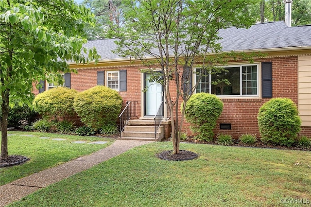 8314 Erma Ln, Richmond, VA 23229 - view of front of house featuring roof with shingles, a front yard, and brick siding