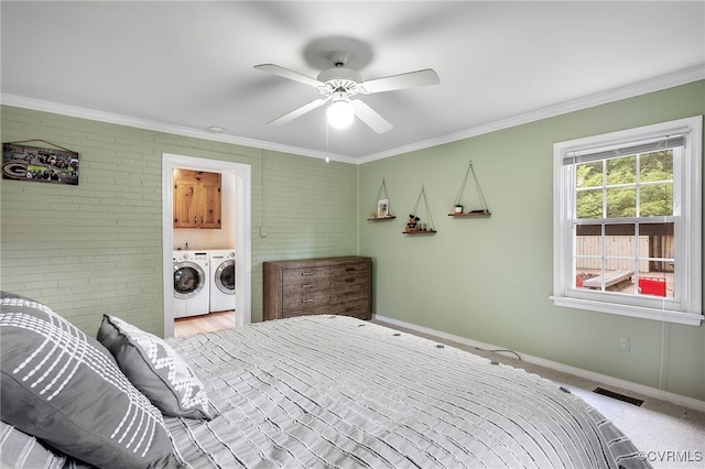 8314 Erma Ln, Richmond, VA 23229 - bedroom featuring washer and dryer, brick wall, ornamental molding, and ceiling fan