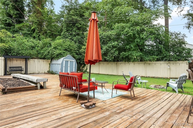 8314 Erma Ln, Richmond, VA 23229 - deck with a shed, a fenced backyard, and an outdoor living space with a fire pit