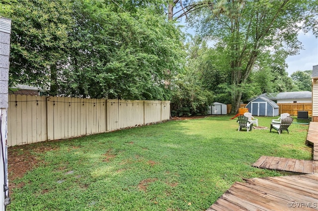 8314 Erma Ln, Richmond, VA 23229 - fenced backyard with a shed and a wooden deck
