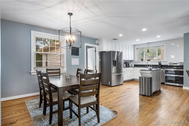 8314 Erma Ln, Richmond, VA 23229 - dining room with a chandelier, plenty of natural light, light wood-style floors, and recessed lighting