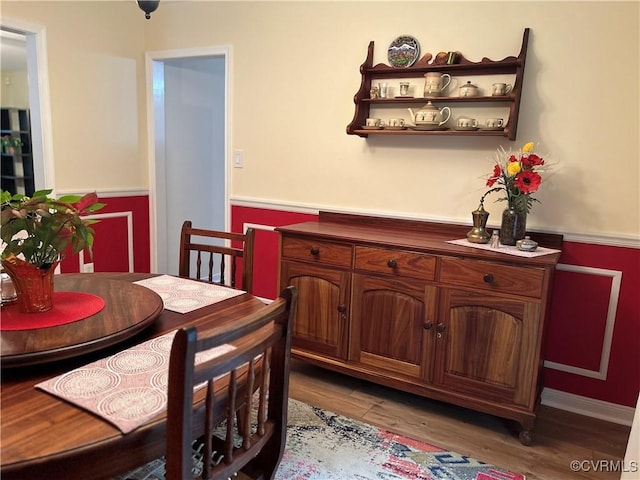 2205 Cox Rd, Henrico, VA 23233 - dining room with a wainscoted wall and wood finished floors