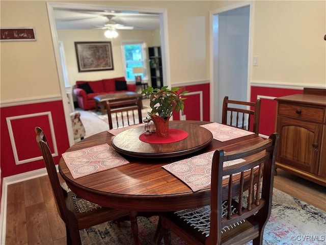 2205 Cox Rd, Henrico, VA 23233 - dining area with wainscoting, ceiling fan, and wood finished floors