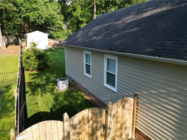 2205 Cox Rd, Henrico, VA 23233 - view of side of property featuring roof with shingles and a fenced backyard