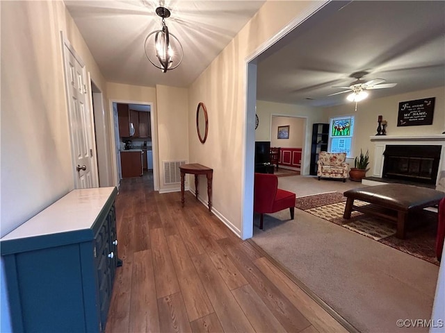 2205 Cox Rd, Henrico, VA 23233 - hallway with dark wood-type flooring and a chandelier