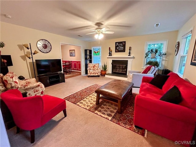 2205 Cox Rd, Henrico, VA 23233 - living room with carpet flooring, a ceiling fan, and a glass covered fireplace