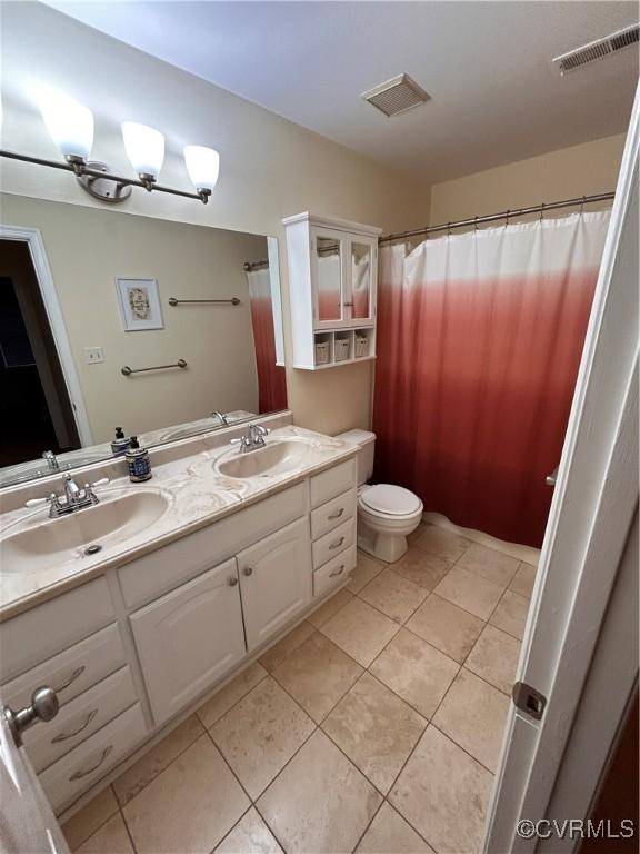 2205 Cox Rd, Henrico, VA 23233 - full bath with double vanity, tile patterned floors, and curtained shower