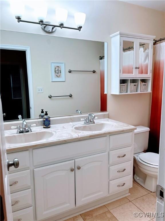 2205 Cox Rd, Henrico, VA 23233 - bathroom featuring double vanity and tile patterned floors