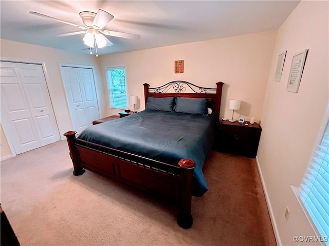 2205 Cox Rd, Henrico, VA 23233 - bedroom featuring multiple closets, carpet floors, and ceiling fan