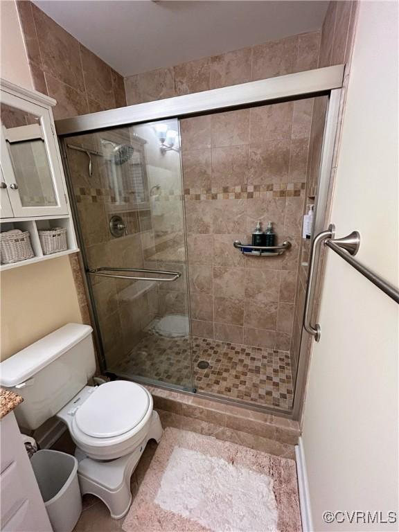 2205 Cox Rd, Henrico, VA 23233 - bathroom featuring a shower stall, vanity, and tile patterned floors