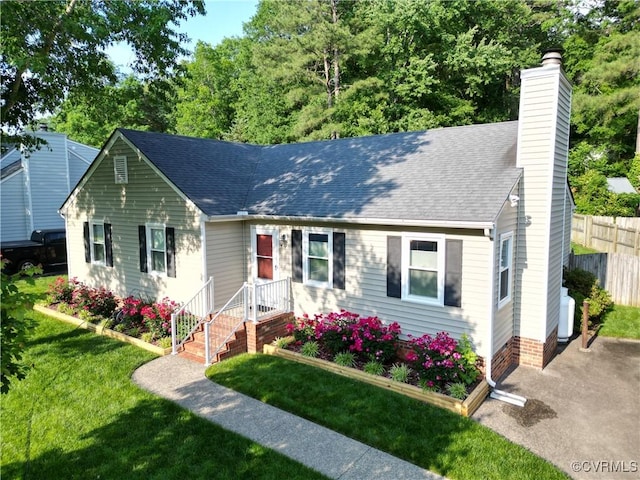 2205 Cox Rd, Henrico, VA 23233 - view of front facade featuring a chimney and roof with shingles