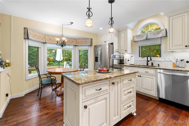 4723 Squaw Valley Ct, Glen Allen, VA 23060 - kitchen with stainless steel appliances, dark wood-type flooring, a chandelier, light stone counters, and pendant lighting