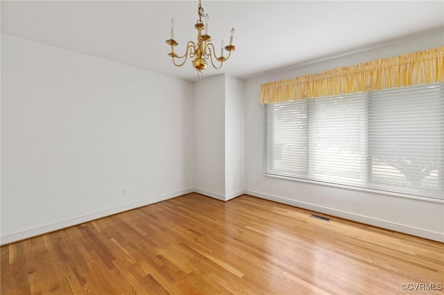 4723 Squaw Valley Ct, Glen Allen, VA 23060 - unfurnished room with a chandelier and light wood-type flooring