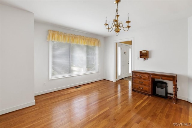 4723 Squaw Valley Ct, Glen Allen, VA 23060 - unfurnished dining area featuring a chandelier and light wood-type flooring