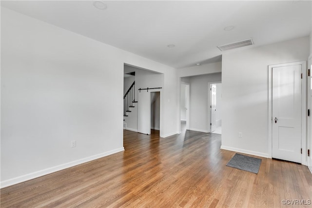 1409 Virginia Ave, Glen Allen, VA 23060 - spare room with light wood-style floors and stairway