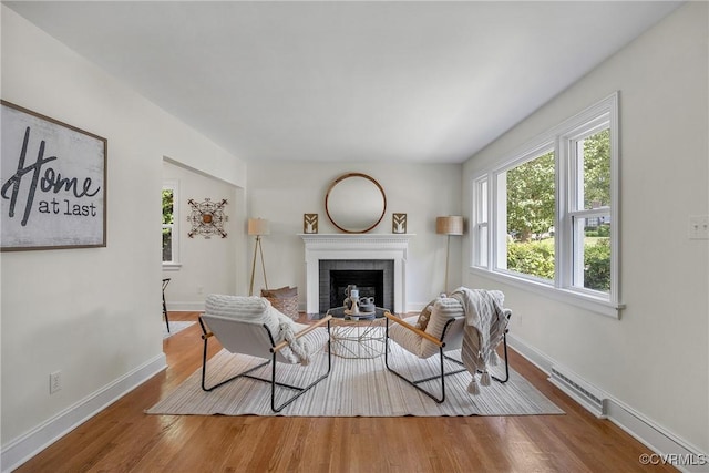 8912 Michaux Ln, Henrico, VA 23229 - living room with a brick fireplace and wood finished floors
