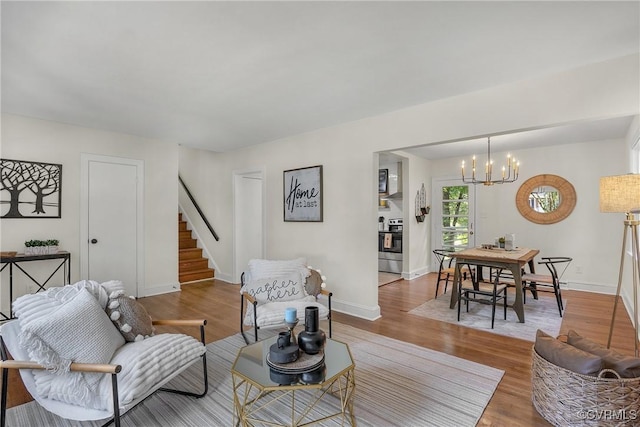 8912 Michaux Ln, Henrico, VA 23229 - living room with stairs, a chandelier, and wood finished floors