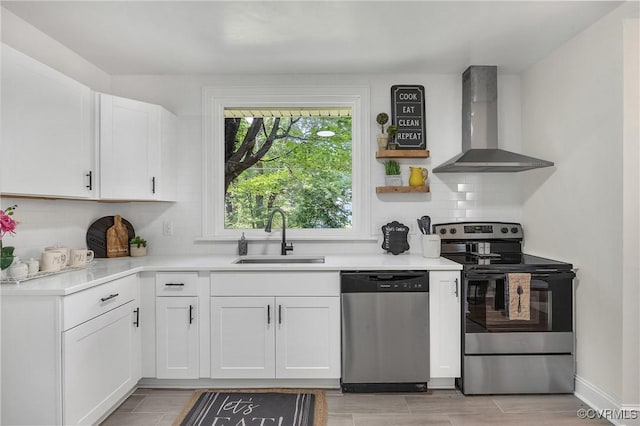 8912 Michaux Ln, Henrico, VA 23229 - kitchen with stainless steel appliances, wall chimney range hood, decorative backsplash, light countertops, and white cabinets