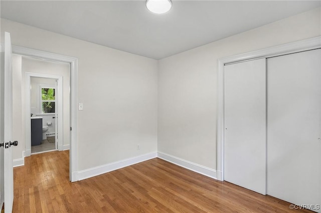 8912 Michaux Ln, Henrico, VA 23229 - unfurnished bedroom featuring wood finished floors and a closet