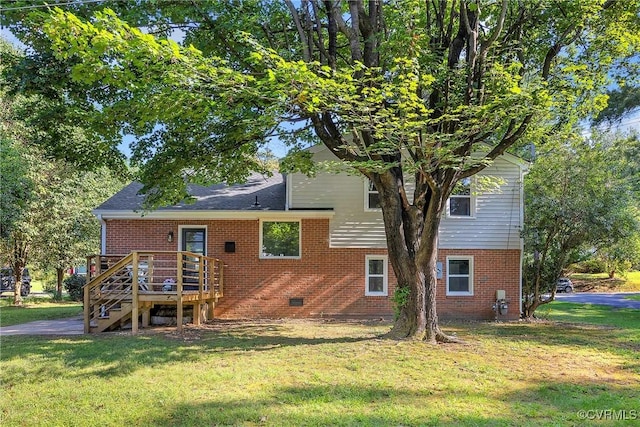 8912 Michaux Ln, Henrico, VA 23229 - back of house featuring brick siding, a lawn, and a wooden deck