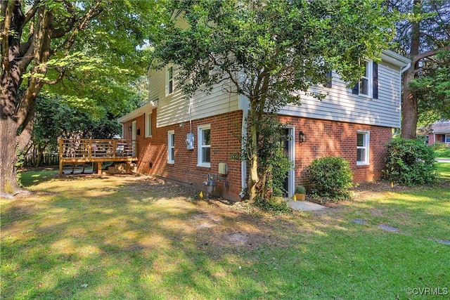 8912 Michaux Ln, Henrico, VA 23229 - back of house with brick siding, a lawn, and a deck