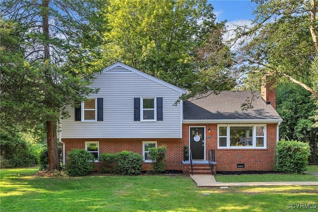 8912 Michaux Ln, Henrico, VA 23229 - tri-level home with a chimney, a front lawn, brick siding, and a shingled roof