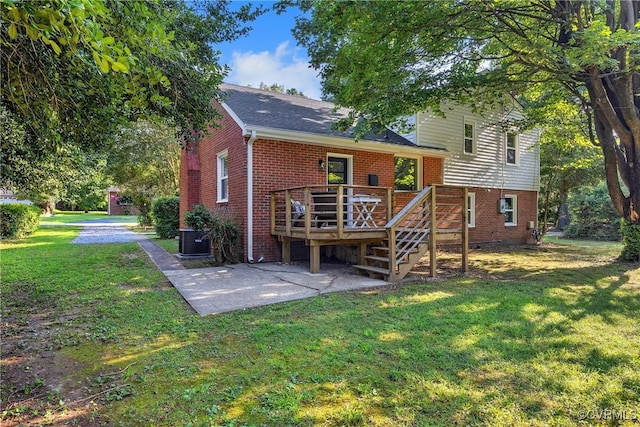 8912 Michaux Ln, Henrico, VA 23229 - rear view of property featuring brick siding, a deck, a lawn, and a patio area