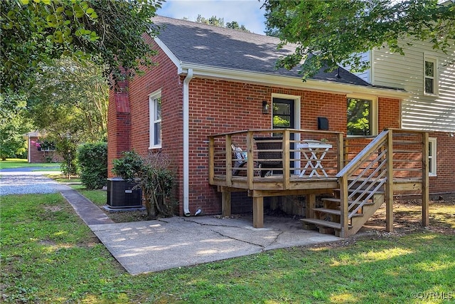 8912 Michaux Ln, Henrico, VA 23229 - rear view of house featuring brick siding, a shingled roof, and a wooden deck