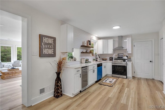 7709 Yolanda Rd, Henrico, VA 23229 - kitchen with stainless steel appliances, wall chimney range hood, open shelves, white cabinets, and light wood finished floors