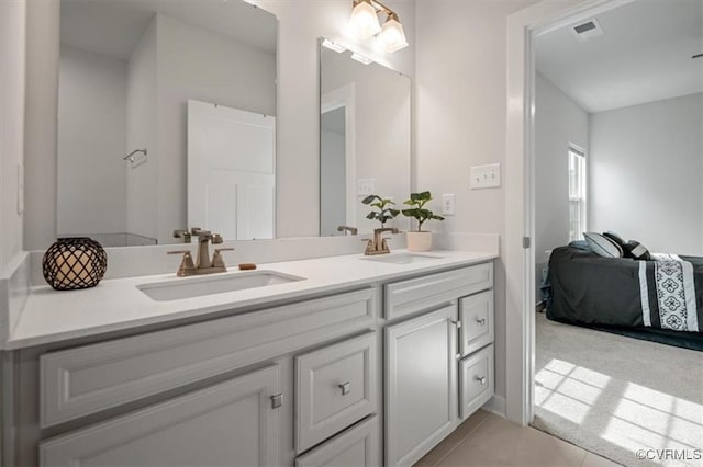 7653 Autumn Leaves Ln, New Kent, VA 23124 - ensuite bathroom with double vanity and tile patterned flooring