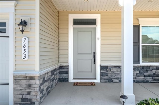 7653 Autumn Leaves Ln, New Kent, VA 23124 - property entrance featuring covered porch and stone siding