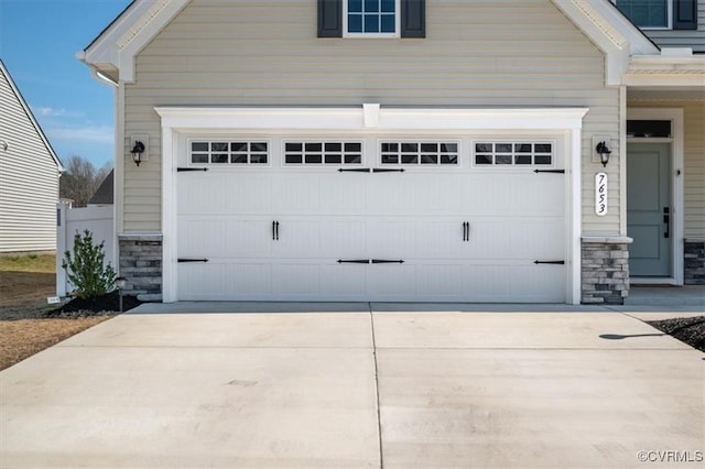 7653 Autumn Leaves Ln, New Kent, VA 23124 - garage with concrete driveway