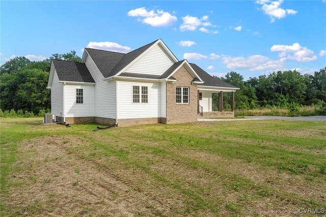 699 Trimmers Shop Rd, King William, VA 23181 - rear view of house with a lawn and brick siding