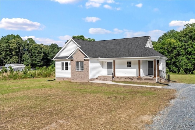 699 Trimmers Shop Rd, King William, VA 23181 - view of front of property featuring a front lawn, roof with shingles, and a porch