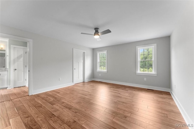 699 Trimmers Shop Rd, King William, VA 23181 - unfurnished room with healthy amount of natural light, a ceiling fan, and light wood-style flooring