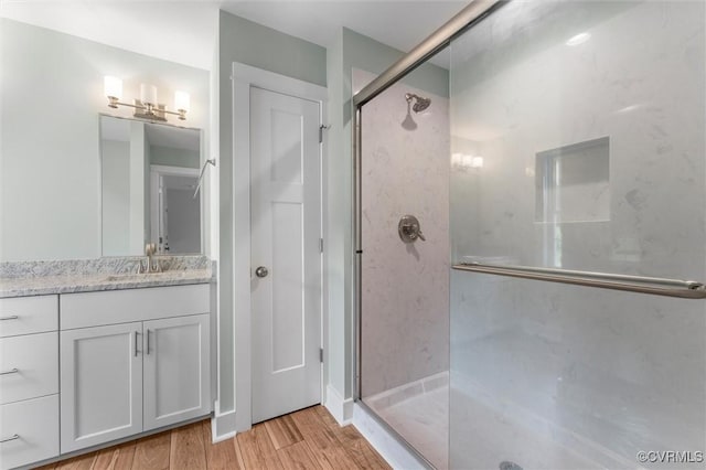 699 Trimmers Shop Rd, King William, VA 23181 - bathroom with a shower stall, vanity, and wood finished floors