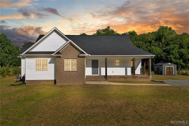 699 Trimmers Shop Rd, King William, VA 23181 - view of front of property with a shed, a front yard, a porch, and brick siding